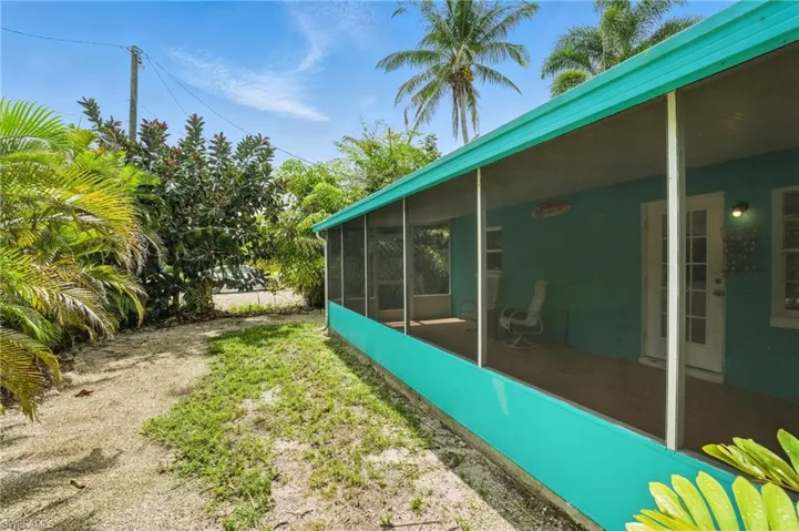 View of yard featuring a sunroom