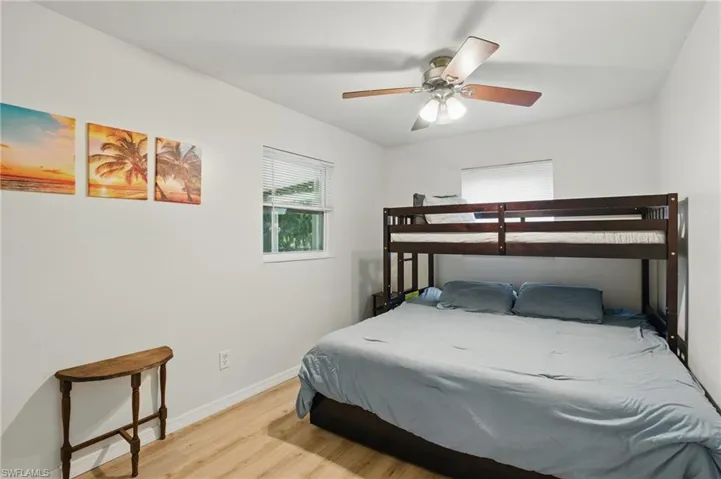 Bedroom featuring light wood-type flooring and ceiling fan