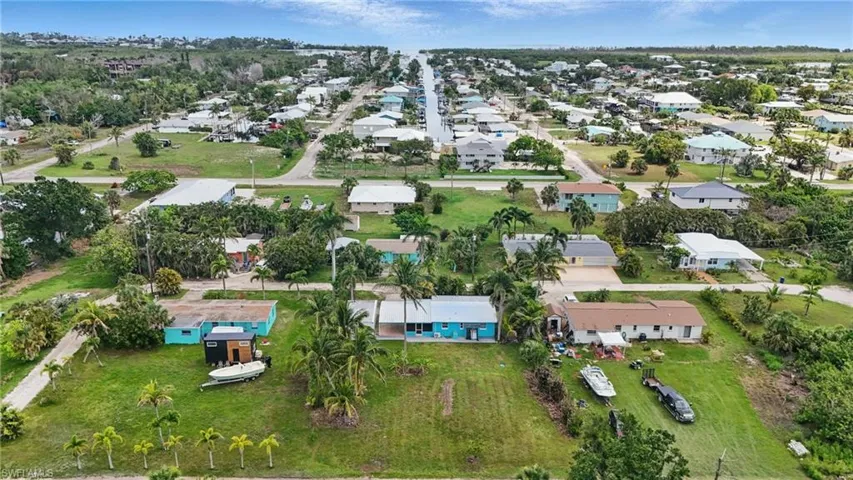 Aerial overview of property's location with nearby suburban area