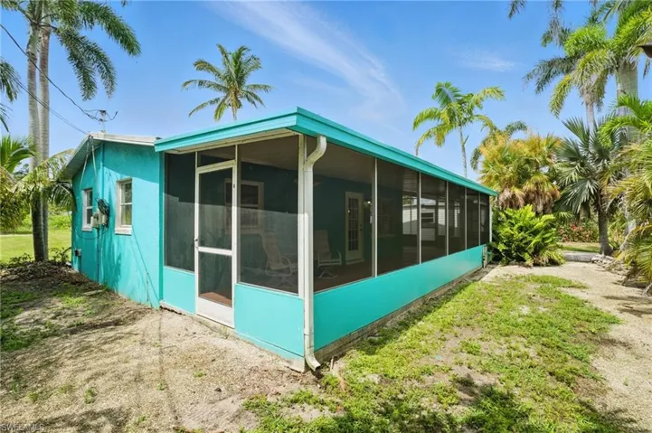 View of home's exterior featuring a sunroom