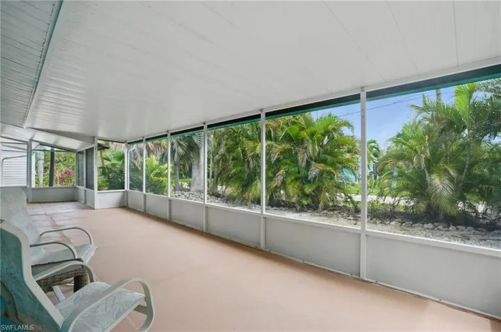 Unfurnished sunroom with plenty of natural light