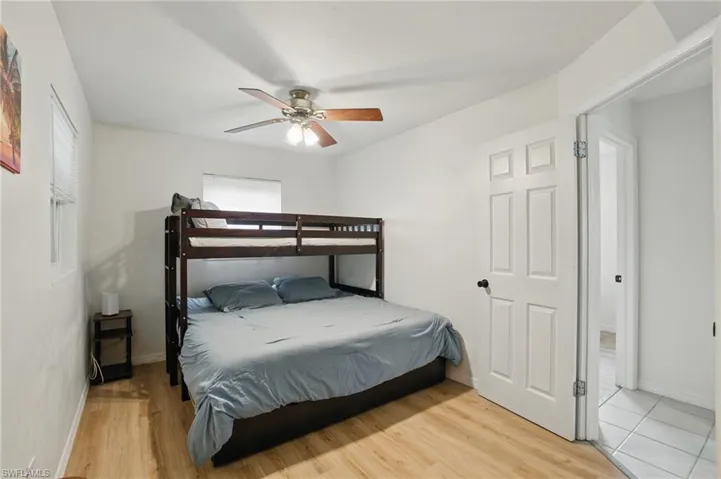Bedroom featuring wood finished floors and a ceiling fan