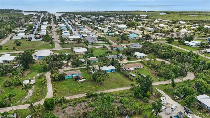 Aerial overview of property's location with nearby suburban area