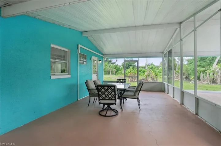 Sunroom / solarium featuring outdoor dining space