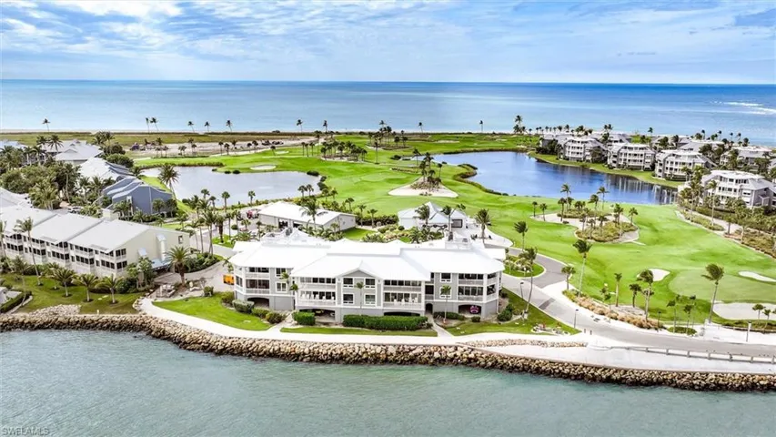 Aerial view of a large body of water and a golf course