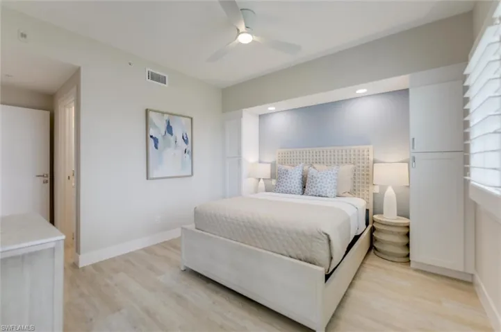 Bedroom featuring light wood finished floors, a ceiling fan, and recessed lighting