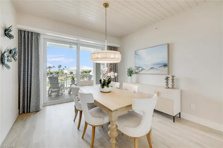 Dining space featuring wood ceiling and light wood-type flooring
