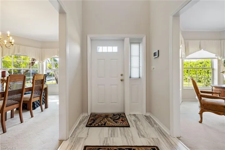 Entryway featuring a chandelier,
