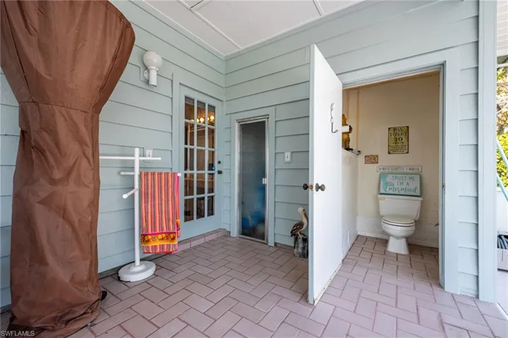 Pool half bath with sauna neighboring