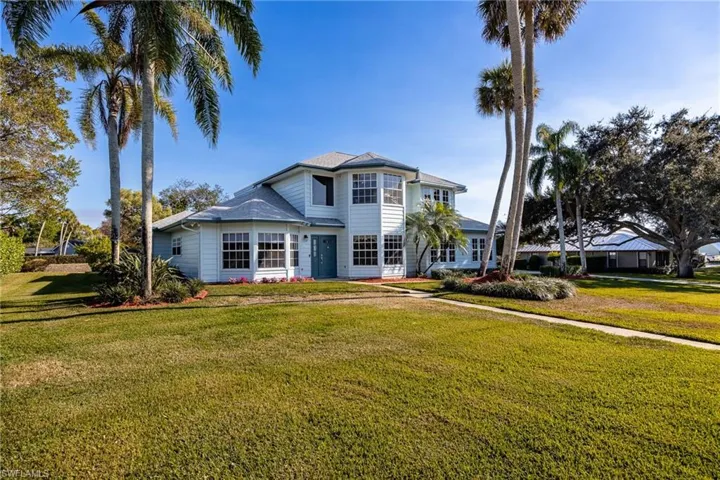 Front view of house with landscaped front yard