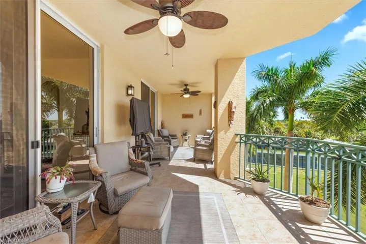Balcony featuring ceiling fan and an outdoor living space