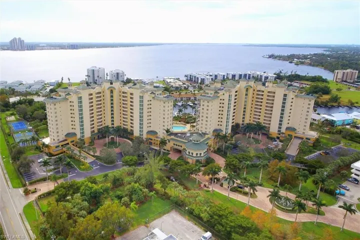 View of urban area featuring apartment complex and a large body of water
