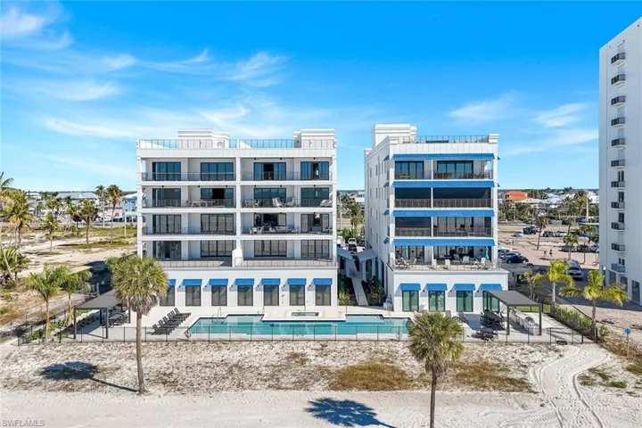 View of apartment building / complex with a community pool