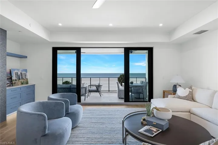 Living area featuring a water view and wood finished floors