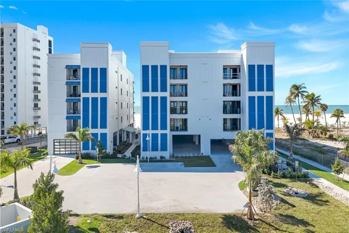 View of apartment building / complex with a water view