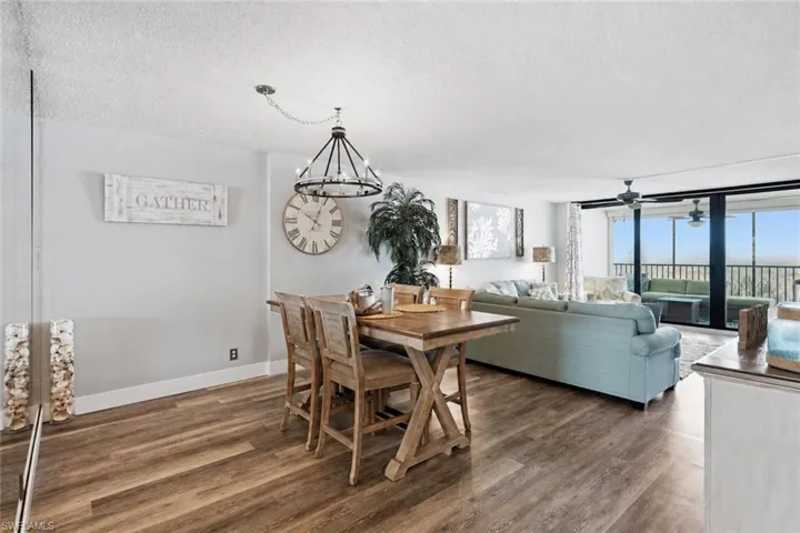 Dining area with a coastal table and buffet with a new dining light