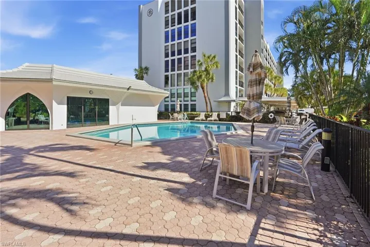Community pool featuring a patio area