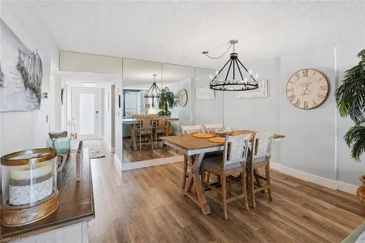 Dining area with a coastal table and buffet with a new dining light