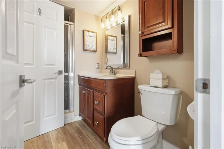 Bathroom with a glass enclosed shower.