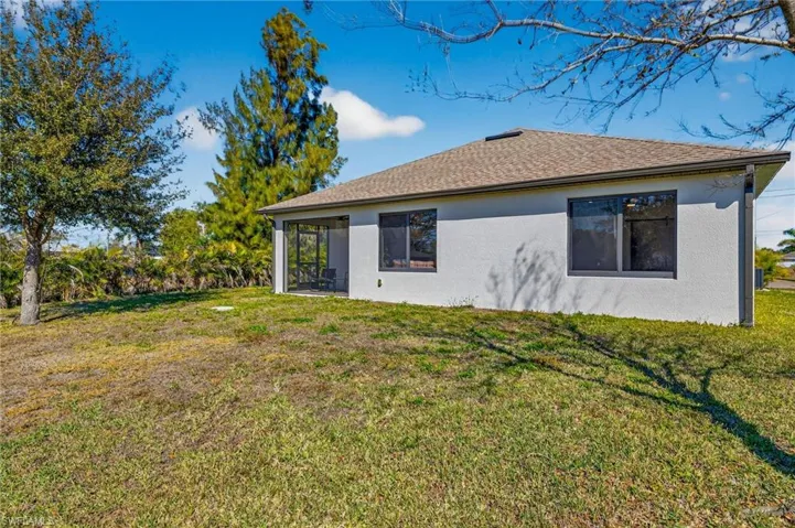 Rear view of property with plenty of room for a beautiful waterfront pool package