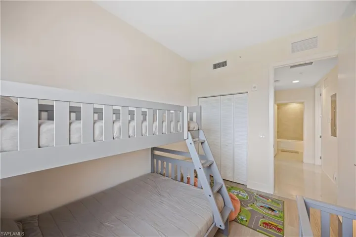 Bedroom with a closet and visible vents