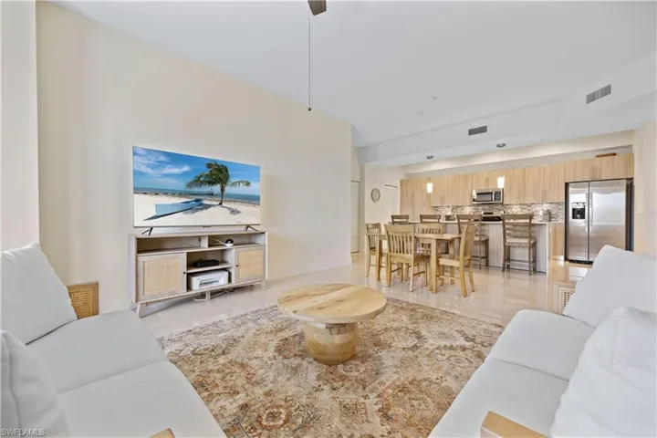 Living room featuring visible vents and light tile patterned floors