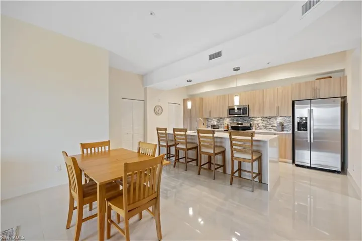 Dining area featuring visible vents, baseboards, and light tile patterned flooring