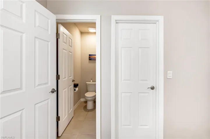 Bathroom featuring toilet and tile patterned floors