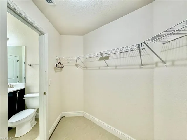 Spacious closet featuring tile patterned floors