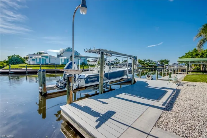 Dock with boat lift and a water view