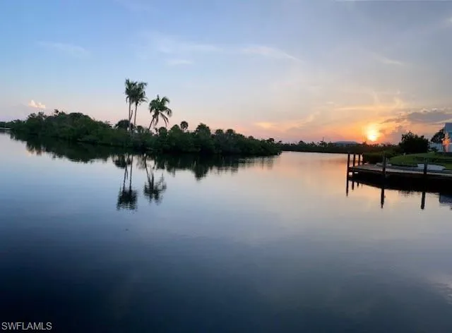Water view featuring a dock