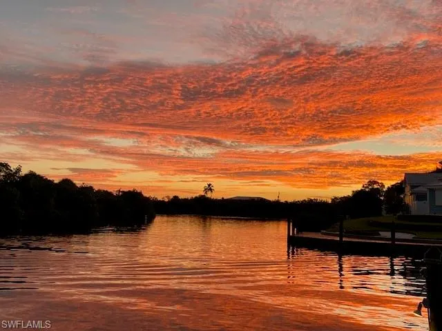 Water view featuring a dock