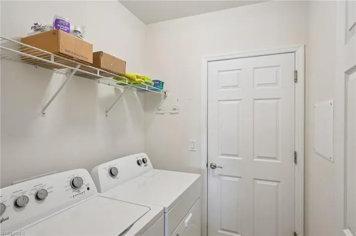 Washroom featuring separate washer and dryer