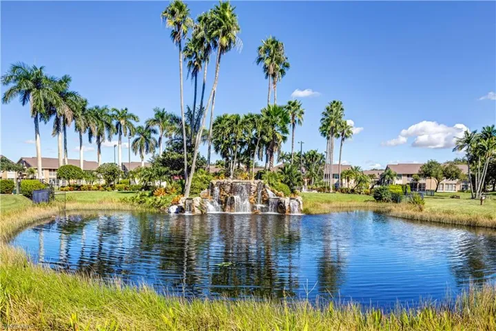 Pond, waterfall infront of pool, clubhouse and gym.