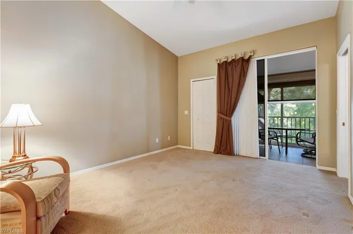 Living area with carpet flooring and ceiling fan