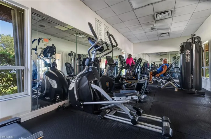 Gym with a paneled ceiling