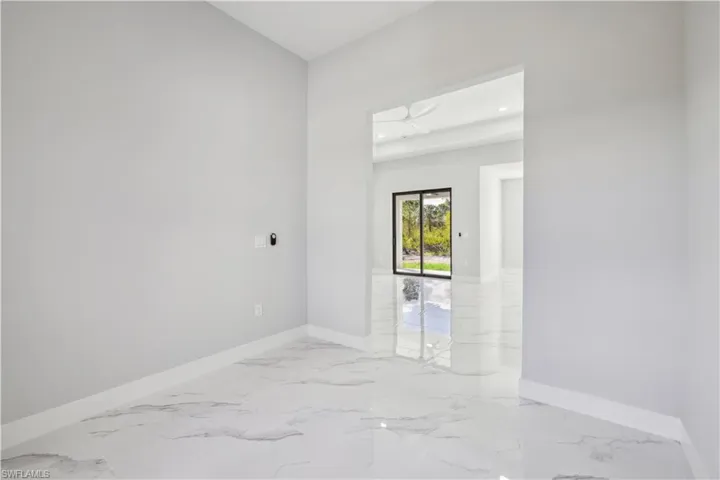 Empty room featuring ceiling fan