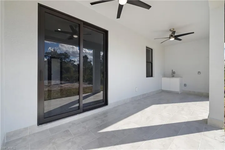 View of patio with ceiling fan