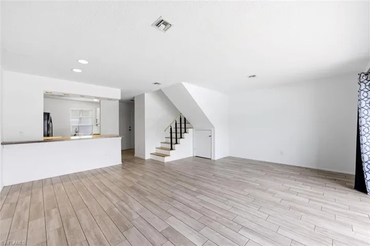 Stairs leading to two master bedrooms