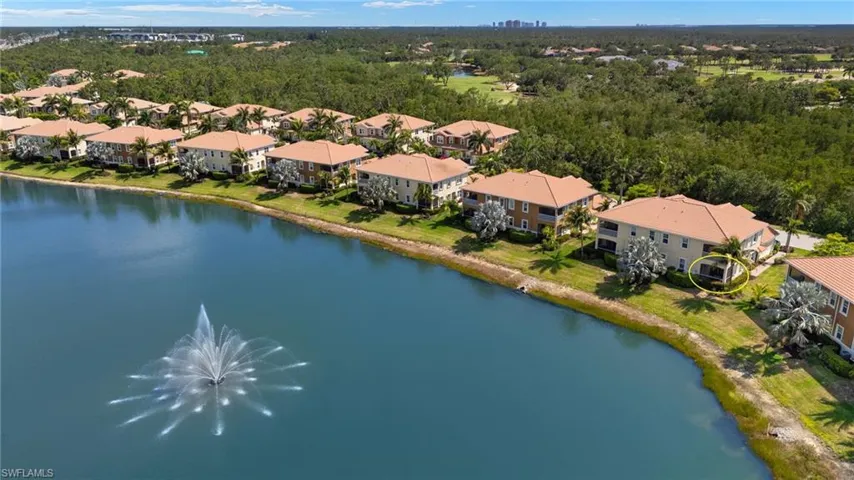 Aerial view of residential area featuring a large body of water