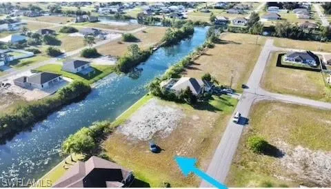 Aerial view of residential area featuring a large body of water