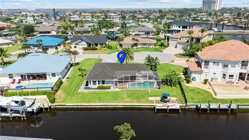 Birds eye view of property featuring a residential view and a water view