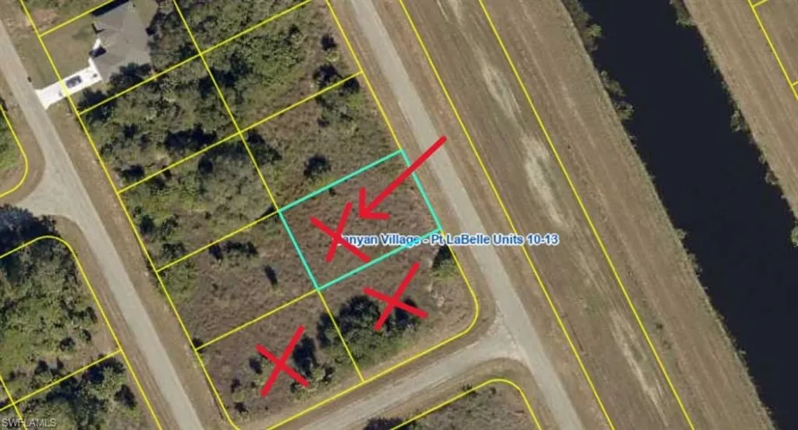 Aerial Survey Map. Depicting a parcel with an outline and markings, adjacent to a waterway and other parcels