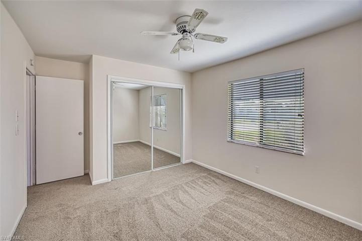 Front Guest Bedroom also features a lighted ceiling fan and large closet.