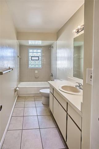 Guest Bath features a Linen closet and combination tub/shower.