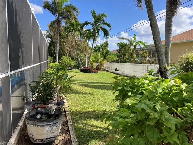 View of yard featuring screen  enclosure
