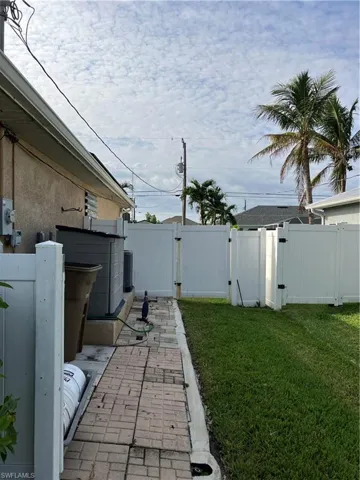 View of yard with cooling unit
