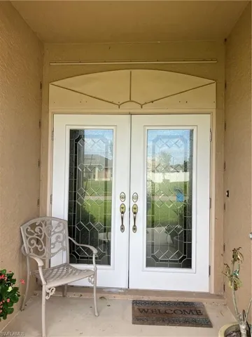 View of exterior entry featuring french doors