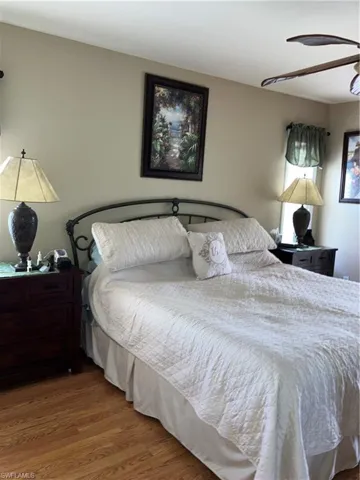 Bedroom featuring hardwood / wood-style floors and ceiling fan
