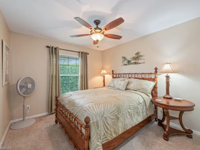 Bedroom with carpet floors and a ceiling fan
